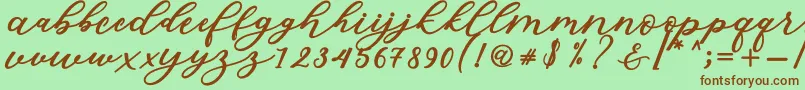 Fonte Isabella Script – fontes marrons em um fundo verde