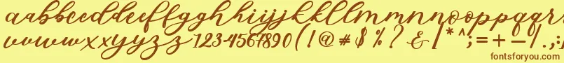 Fonte Isabella Script – fontes marrons em um fundo amarelo