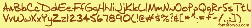 フォントj d – 茶色の文字が黄色の背景にあります。