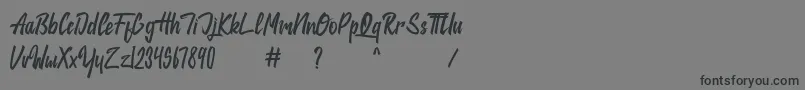 jackie-Schriftart – Schwarze Schriften auf grauem Hintergrund