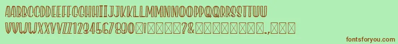 JacklynMilner-fontti – ruskeat fontit vihreällä taustalla