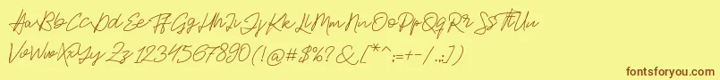 フォントJackson Script – 茶色の文字が黄色の背景にあります。