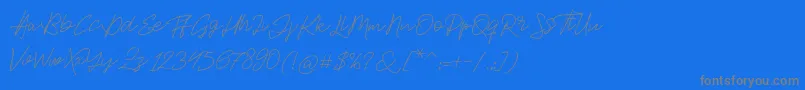 Jackson Script-fontti – harmaat kirjasimet sinisellä taustalla