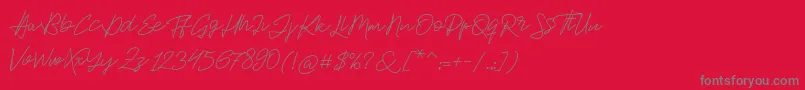 フォントJackson Script – 赤い背景に灰色の文字