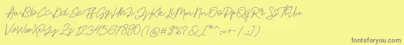 Jackson Script-fontti – harmaat kirjasimet keltaisella taustalla