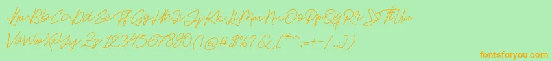 Jackson Script-Schriftart – Orangefarbene Schriften auf grünem Hintergrund