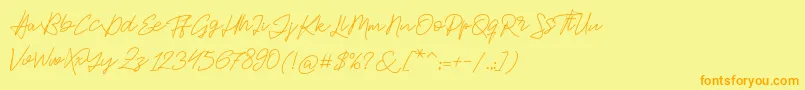 フォントJackson Script – オレンジの文字が黄色の背景にあります。