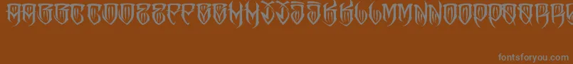 フォントJAKEJARKOR   FELONA – 茶色の背景に灰色の文字