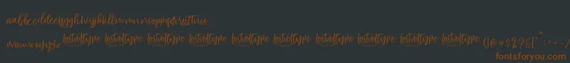 VayenthaScript Font – Brown Fonts on Black Background