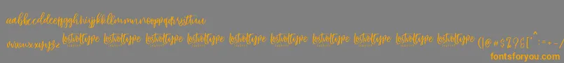 VayenthaScript Font – Orange Fonts on Gray Background