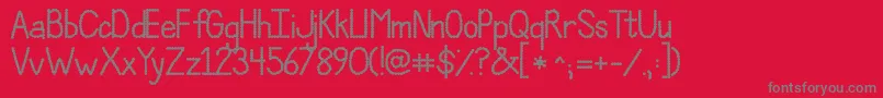 Шрифт JandaPolkadotParty – серые шрифты на красном фоне