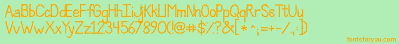 フォントJandaPolkadotParty – オレンジの文字が緑の背景にあります。