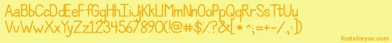 フォントJandaPolkadotParty – オレンジの文字が黄色の背景にあります。
