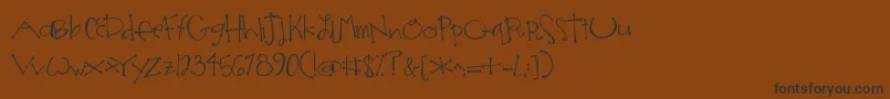 フォントJandaSomeoneLikeYou2 – 黒い文字が茶色の背景にあります