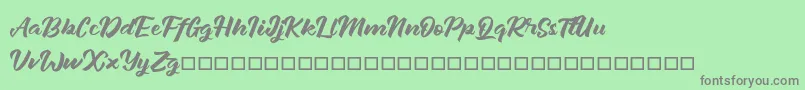 Janetalus Font – Gray Fonts on Green Background