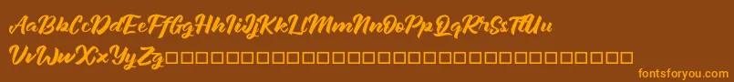 Janetalus Font – Orange Fonts on Brown Background