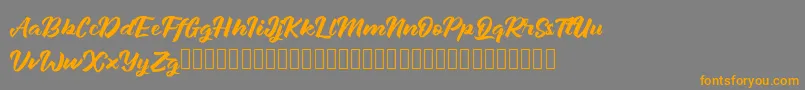 Janetalus Font – Orange Fonts on Gray Background