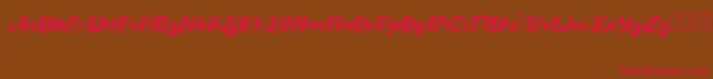 JanethJohn Font – Red Fonts on Brown Background