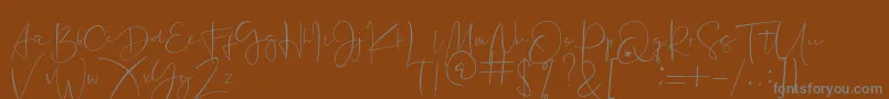 Jannet-Schriftart – Graue Schriften auf braunem Hintergrund