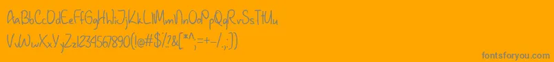 January Handwriting  -Schriftart – Graue Schriften auf orangefarbenem Hintergrund