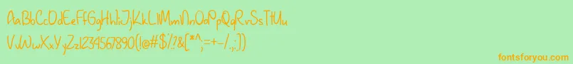 January Handwriting   Font – Orange Fonts on Green Background