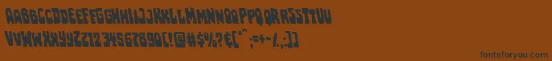 Pocketmonsterleft-Schriftart – Schwarze Schriften auf braunem Hintergrund