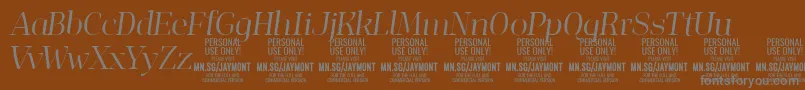 フォントJaymontLii PERSONAL USE – 茶色の背景に灰色の文字