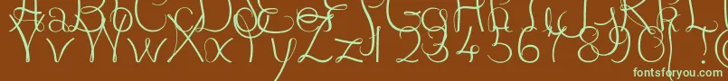 フォントJBCourbes Regular – 緑色の文字が茶色の背景にあります。