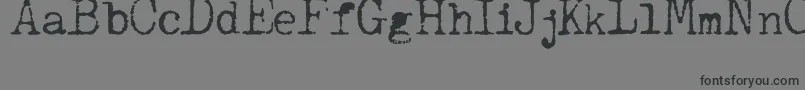 フォントJCAguirrep   Old Type – 黒い文字の灰色の背景
