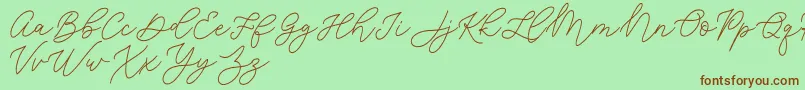 Шрифт Jean Jingga   – коричневые шрифты на зелёном фоне