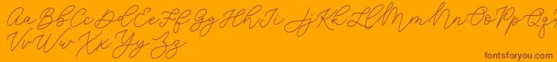 Jean Jingga  -Schriftart – Braune Schriften auf orangefarbenem Hintergrund