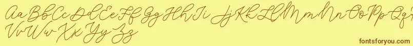 Шрифт Jean Jingga   – коричневые шрифты на жёлтом фоне