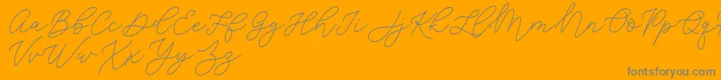 フォントJean Jingga   – オレンジの背景に灰色の文字