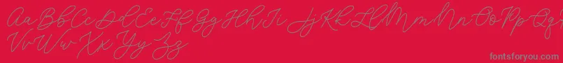 Jean Jingga  -fontti – harmaat kirjasimet punaisella taustalla