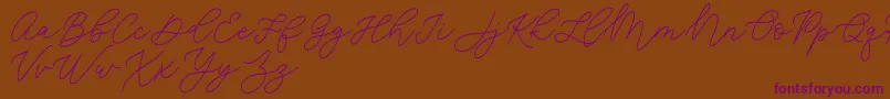 Czcionka Jean Jingga   – fioletowe czcionki na brązowym tle
