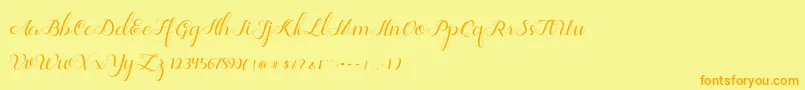 Jelita-Schriftart – Orangefarbene Schriften auf gelbem Hintergrund