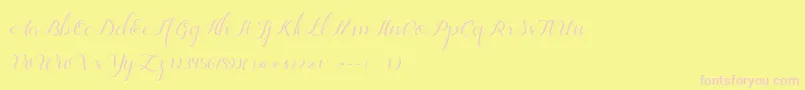 Jelita-Schriftart – Rosa Schriften auf gelbem Hintergrund