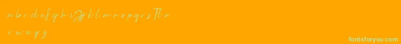 フォントJellaine demo – オレンジの背景に緑のフォント