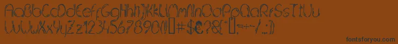 JELUDN   Font – Black Fonts on Brown Background