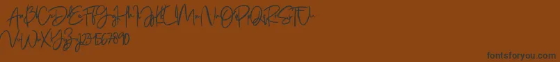 Jenifa free Font – Black Fonts on Brown Background