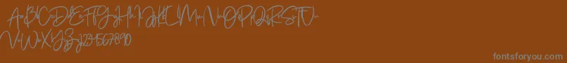 Jenifa free Font – Gray Fonts on Brown Background