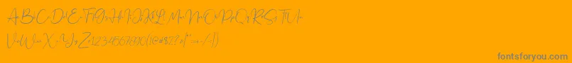Jennifer demo-fontti – harmaat kirjasimet oranssilla taustalla