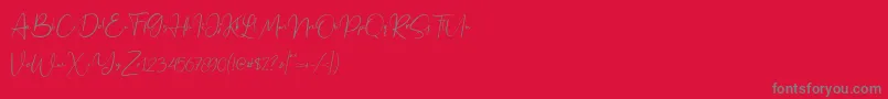 Jennifer demo-fontti – harmaat kirjasimet punaisella taustalla