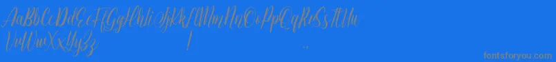 Jessie Odelya Demo-Schriftart – Graue Schriften auf blauem Hintergrund