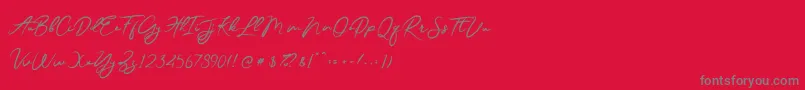 フォントJesterBrush – 赤い背景に灰色の文字