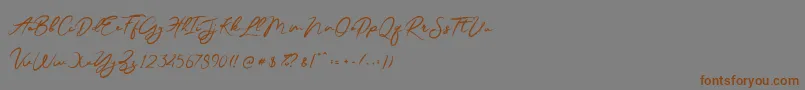 JesterBrush-Schriftart – Braune Schriften auf grauem Hintergrund