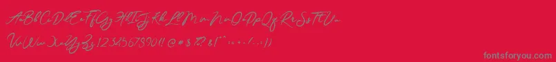 JesterBrush-Schriftart – Graue Schriften auf rotem Hintergrund