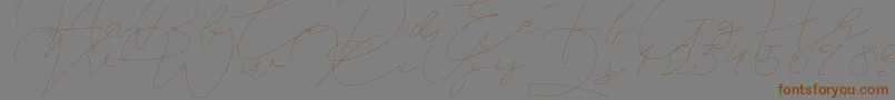 Jet Seat Script-Schriftart – Braune Schriften auf grauem Hintergrund