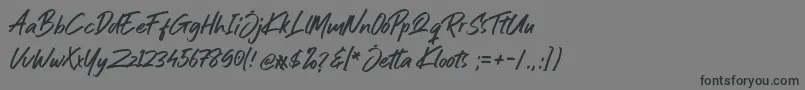 Шрифт Jetta Kloots Font – чёрные шрифты на сером фоне