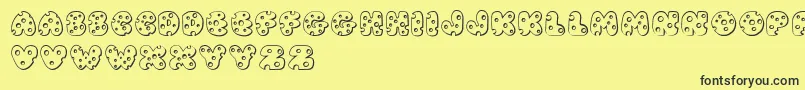 フォントJI Swiss Cheese – 黒い文字の黄色い背景